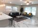 Open concept living room with a comfortable seating area and modern finishes at 2042 Craft Ln, Sarasota, FL 34239