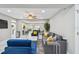 Modern living room with stylish marble floors, comfortable seating, and an open layout to the kitchen at 2042 Craft Ln, Sarasota, FL 34239