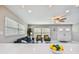 Living area with stylish marble floors, bright windows, and comfortable seating, creating a cozy ambiance at 2042 Craft Ln, Sarasota, FL 34239