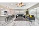 Bright and modern living room features a kitchen bar, comfortable seating, and natural light at 2042 Craft Ln, Sarasota, FL 34239