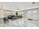 Inviting living space with ample natural light, marble floors, and comfortable seating arrangements at 2042 Craft Ln, Sarasota, FL 34239