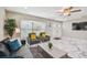 Bright living room with marble floors, bay window, and comfortable seating, offering a welcoming ambiance at 2042 Craft Ln, Sarasota, FL 34239