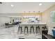 Spacious living area with a view of the modern kitchen and bar seating at 2042 Craft Ln, Sarasota, FL 34239