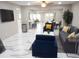 Open-concept living space with modern furnishings and bright, stylish marble floors at 2042 Craft Ln, Sarasota, FL 34239