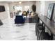 Spacious, open concept living area with modern furniture and stylish marble floors at 2042 Craft Ln, Sarasota, FL 34239