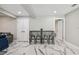 Living space featuring bar seating, recessed lighting, and two entry doors at 2042 Craft Ln, Sarasota, FL 34239