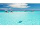Beautiful turquoise ocean waters with several boats anchored under a clear sky at 2042 Craft Ln, Sarasota, FL 34239