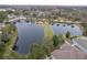 An aerial shot shows neighborhood ponds with fountains and landscaping around community at 21215 Tyrell Way, Land O Lakes, FL 34638