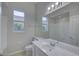 Bright bathroom featuring a large mirror, vanity with sink, and toilet at 21215 Tyrell Way, Land O Lakes, FL 34638