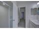 Bathroom featuring a large shower, updated lighting, and tile floors at 21215 Tyrell Way, Land O Lakes, FL 34638