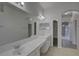 Spacious bathroom with double vanity, bright lighting, and a large mirror at 21215 Tyrell Way, Land O Lakes, FL 34638
