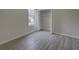 Cozy bedroom featuring carpet, large window, and ample closet space at 21215 Tyrell Way, Land O Lakes, FL 34638