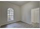 Inviting bedroom with wood-look flooring, large window, and trim detail at 21215 Tyrell Way, Land O Lakes, FL 34638
