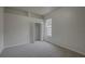 Bedroom with neutral carpet, bright window, and closet space at 21215 Tyrell Way, Land O Lakes, FL 34638