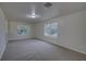 Upstairs bonus room with plush carpet, natural light, and plenty of space to entertain at 21215 Tyrell Way, Land O Lakes, FL 34638