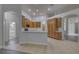 Bright, open kitchen showcasing modern appliances, tile floors, and seamless flow to living spaces at 21215 Tyrell Way, Land O Lakes, FL 34638
