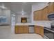 Spacious kitchen featuring stainless steel appliances and views of the living area and backyard at 21215 Tyrell Way, Land O Lakes, FL 34638