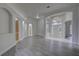Spacious living room with wood-look floors, archways, and an open floor plan at 21215 Tyrell Way, Land O Lakes, FL 34638