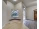 Cozy living room nook featuring a built-in bench seat and views of the screened-in pool area at 21215 Tyrell Way, Land O Lakes, FL 34638
