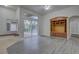 Bright living room with a built-in entertainment center and sliding glass doors to the pool area at 21215 Tyrell Way, Land O Lakes, FL 34638