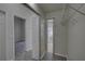Walk-in closet leads to hallway with an open door to bathroom at 21215 Tyrell Way, Land O Lakes, FL 34638