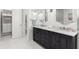 Bright bathroom with a double vanity, and walk in shower at 214 S Audubon Ave, Tampa, FL 33609