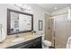 Beautiful bathroom boasts granite counters, vanity, and a large walk-in shower at 214 S Audubon Ave, Tampa, FL 33609