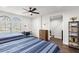 Comfortable bedroom features two beds, ceiling fan, and lots of natural light at 214 S Audubon Ave, Tampa, FL 33609