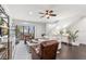 Bright and airy living room with comfortable seating, a ceiling fan, and access to an outdoor balcony at 214 S Audubon Ave, Tampa, FL 33609