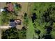 Aerial view of property with in-ground pool, back deck, and private lake access at 219 Galaxy Ave, Spring Hill, FL 34606