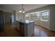 Bright kitchen featuring an island with bar seating and an adjacent bay window at 219 Galaxy Ave, Spring Hill, FL 34606