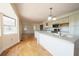 Spacious kitchen with large island, white cabinetry, and modern stainless steel appliances at 219 Galaxy Ave, Spring Hill, FL 34606