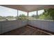 Cozy screened porch with wood floors, perfect for enjoying the outdoors at 219 Galaxy Ave, Spring Hill, FL 34606