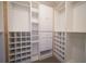 Walk-in closet featuring custom shelving, built-in drawers, and ample storage space at 219 Galaxy Ave, Spring Hill, FL 34606