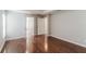 Bedroom with hardwood floors and doors leading to the bathroom and closet at 2203 Malaga Ave, Spring Hill, FL 34609