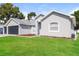 Well maintained single Gathering home with a lush green lawn and three car garage at 2203 Malaga Ave, Spring Hill, FL 34609