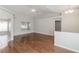 Bright and open living room featuring hardwood floors, high ceilings, and lots of natural light at 2203 Malaga Ave, Spring Hill, FL 34609