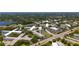 Community shot from above showing proximity to a lake, community pool, and roads at 2284 Philippine Dr # 7, Clearwater, FL 33763