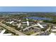 Community shot from above showing proximity to a lake, community pool, and roads at 2284 Philippine Dr # 7, Clearwater, FL 33763
