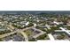 Community shot from above showing mature trees, parking, and roads at 2284 Philippine Dr # 7, Clearwater, FL 33763