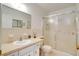 Traditional bathroom featuring a single sink, vanity, and a shower with sliding doors at 2284 Philippine Dr # 7, Clearwater, FL 33763