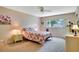 Cozy bedroom featuring a ceiling fan, neutral walls, and comfortable carpet flooring at 2284 Philippine Dr # 7, Clearwater, FL 33763