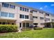 Exterior of home showing the back with patios and grassy area at 2284 Philippine Dr # 7, Clearwater, FL 33763