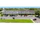 Condominium building featuring a parking lot, maintained landscaping and a secure exterior staircase at 2284 Philippine Dr # 7, Clearwater, FL 33763