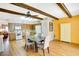 Bright eat-in kitchen featuring wood cabinets, white appliances, and a dining table with seating at 2284 Philippine Dr # 7, Clearwater, FL 33763