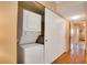 A laundry closet with a stacked washer and dryer at 2284 Philippine Dr # 7, Clearwater, FL 33763