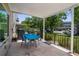Exterior patio with a blue covered table and seating with outside views at 2284 Philippine Dr # 7, Clearwater, FL 33763