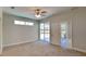 Bright bedroom featuring neutral walls and carpet flooring at 2416 Caraway Dr, Venice, FL 34292