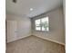 This bedroom has neutral colors, carpet, a window, and is ready for customization at 2416 Caraway Dr, Venice, FL 34292