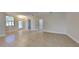 Open living space featuring tile floors, neutral walls, recessed lighting, and an exterior door at 2416 Caraway Dr, Venice, FL 34292